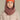 capuche pour enfant nopé de couleur vieux rose avec un beanie de couleur tangerine